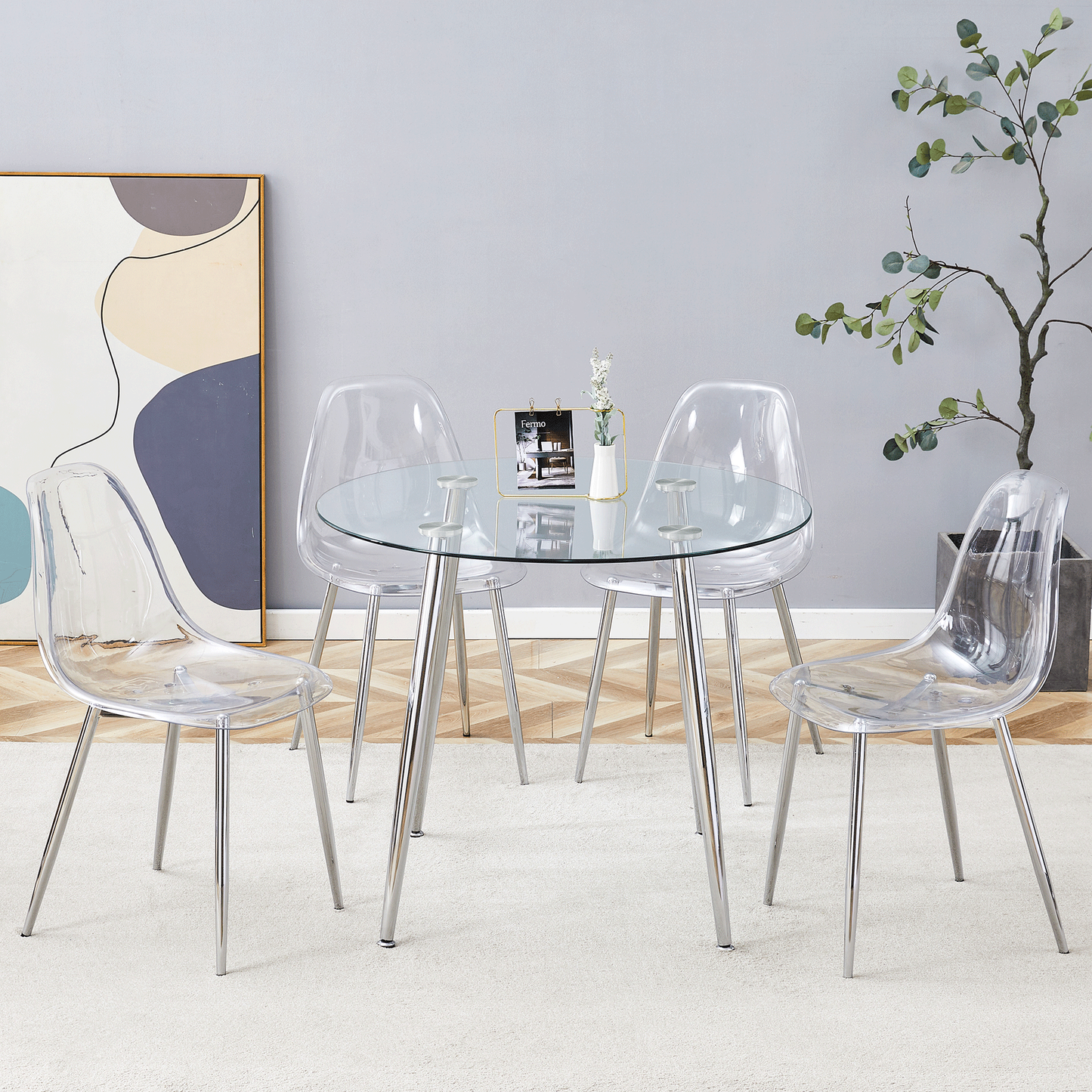 Table and chair set.A modern minimalist style round transparent tempered glass table, silver metal legs, paired with 4 modern style transparent dining chairs,bringing a luxurious experience.
