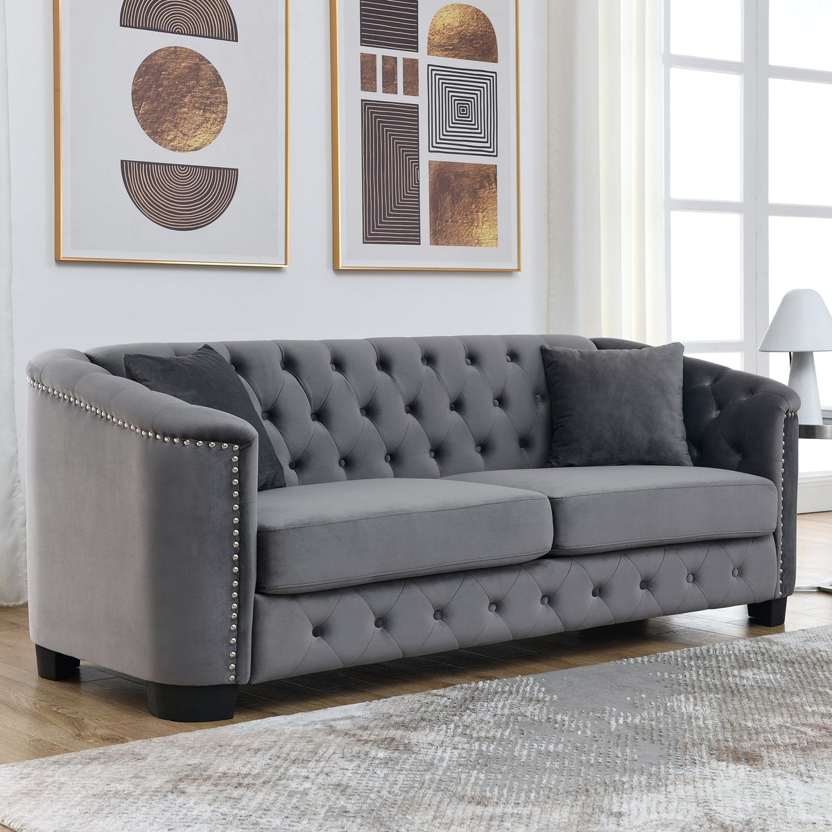 Velvet Chelsfield Sofa Set, featuring extra-deep seat cushions with padded armrests, tufted buttons, and brass studs, complete with throw pillows and plastic legs