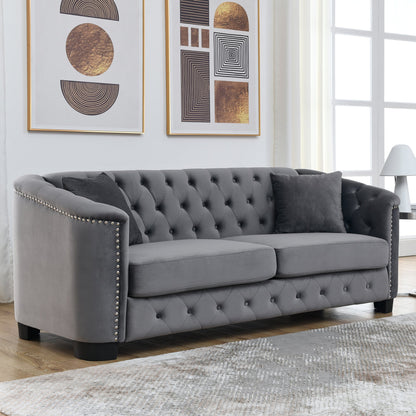 Velvet Chelsfield Sofa Set, featuring extra-deep seat cushions with padded armrests, tufted buttons, and brass studs, complete with throw pillows and plastic legs