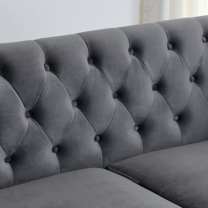 Velvet Chelsfield Sofa Set, featuring extra-deep seat cushions with padded armrests, tufted buttons, and brass studs, complete with throw pillows and plastic legs