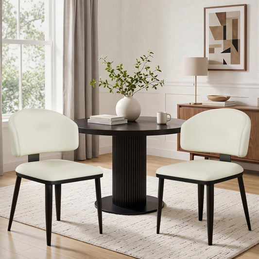 Set of 2 beige armless faux leather dining chairs with curved backrests. Easy to assemble and wipe clean. Modern minimalist style, ideal for dining rooms, cafes and small spaces.
