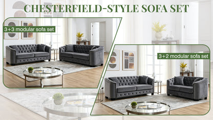 Velvet Chelsfield Sofa Set, featuring extra-deep seat cushions with padded armrests, tufted buttons, and brass studs, complete with throw pillows and plastic legs