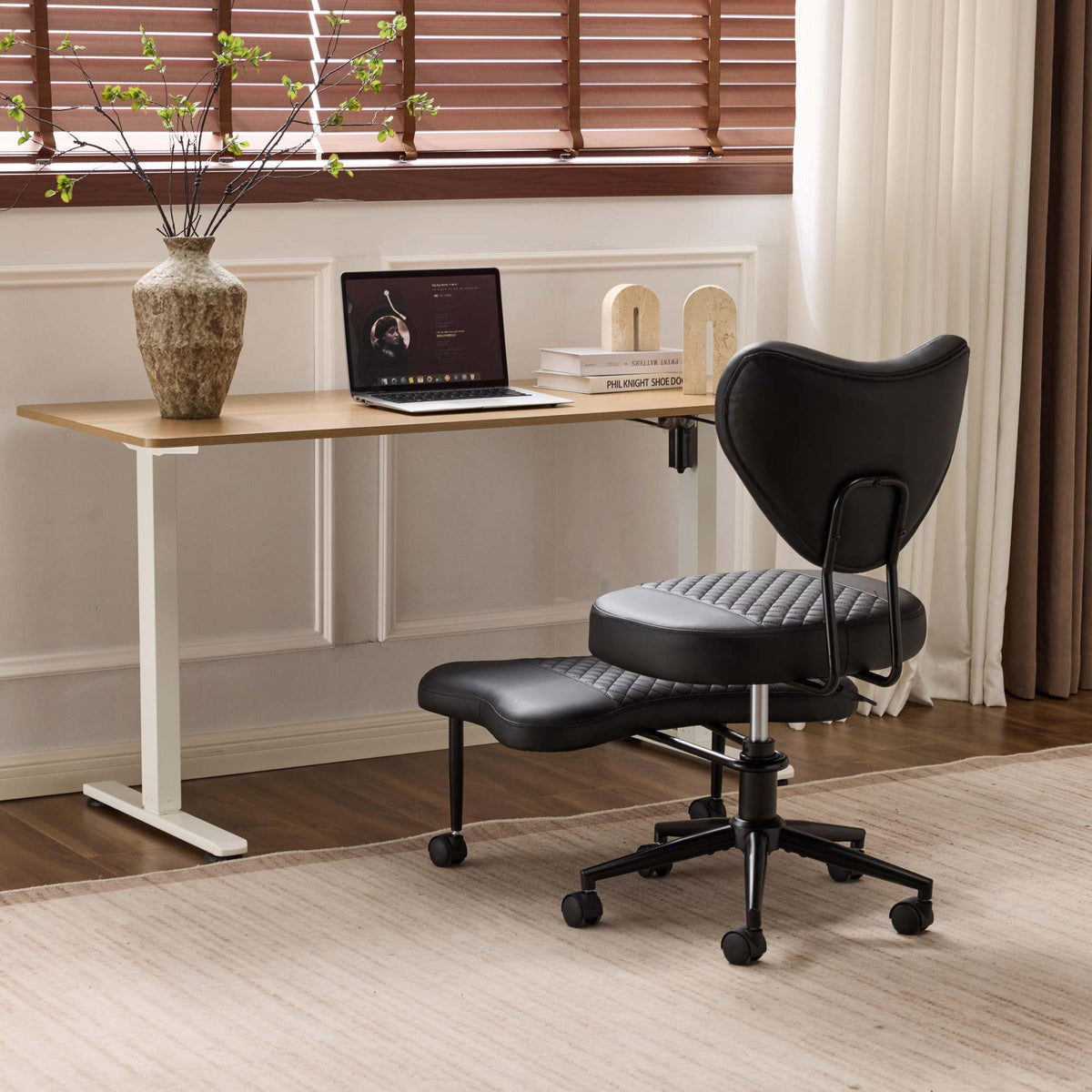 Meditation chair, an ergonomic cross-legged seating chair with lumbar support and a height-adjustable seat cushion, ideal for people engaged in high-intensity office work. Black