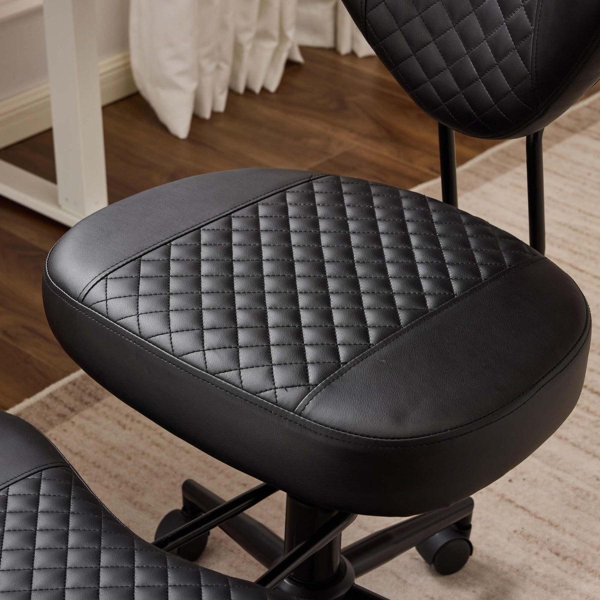 Meditation chair, an ergonomic cross-legged seating chair with lumbar support and a height-adjustable seat cushion, ideal for people engaged in high-intensity office work. Black
