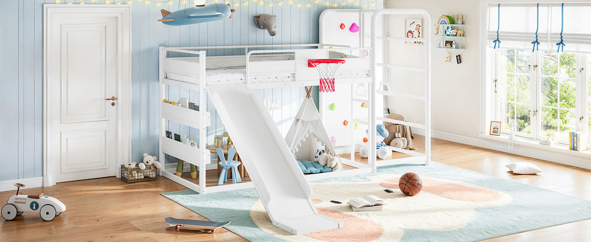 Twin size metal loft/bunk bed with basketball hoop, pull-up rings, climbing wall, and built-in bookshelves. Playful children's design featuring a slide,White.