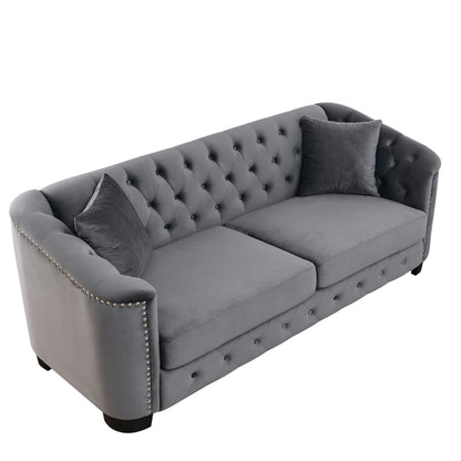 Velvet Chelsfield Sofa Set, featuring extra-deep seat cushions with padded armrests, tufted buttons, and brass studs, complete with throw pillows and plastic legs