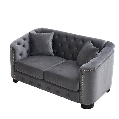 Velvet Chelsfield Sofa Set, featuring extra-deep seat cushions with padded armrests, tufted buttons, and brass studs, complete with throw pillows and plastic legs