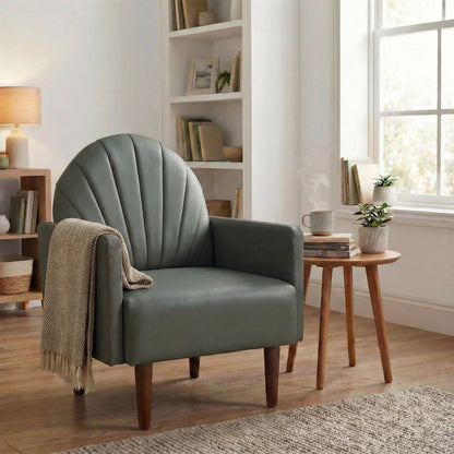 A contemporary shell-shaped armchair with PU leather upholstery and wooden legs, suitable for living rooms, balconies, children's rooms and studies.