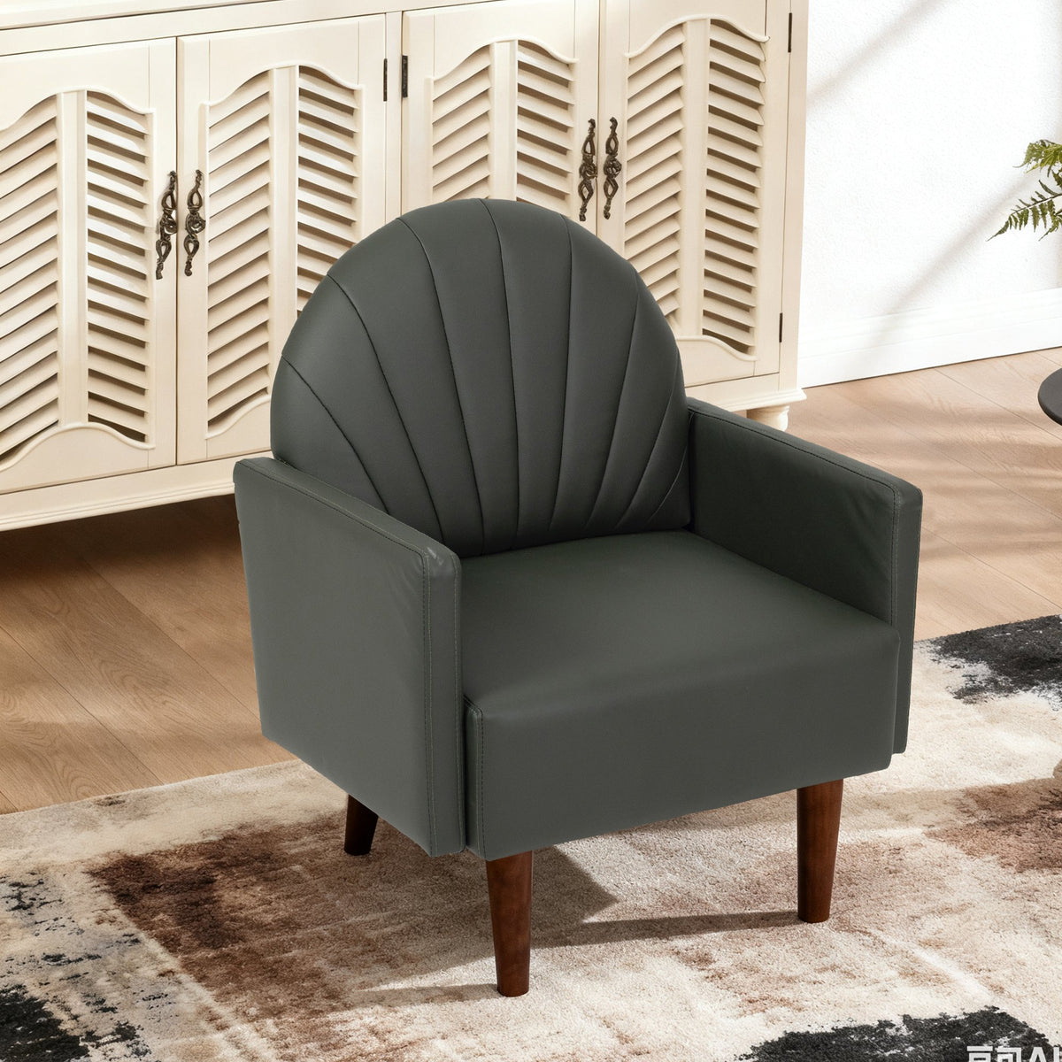 A contemporary shell-shaped armchair with PU leather upholstery and wooden legs, suitable for living rooms, balconies, children's rooms and studies.